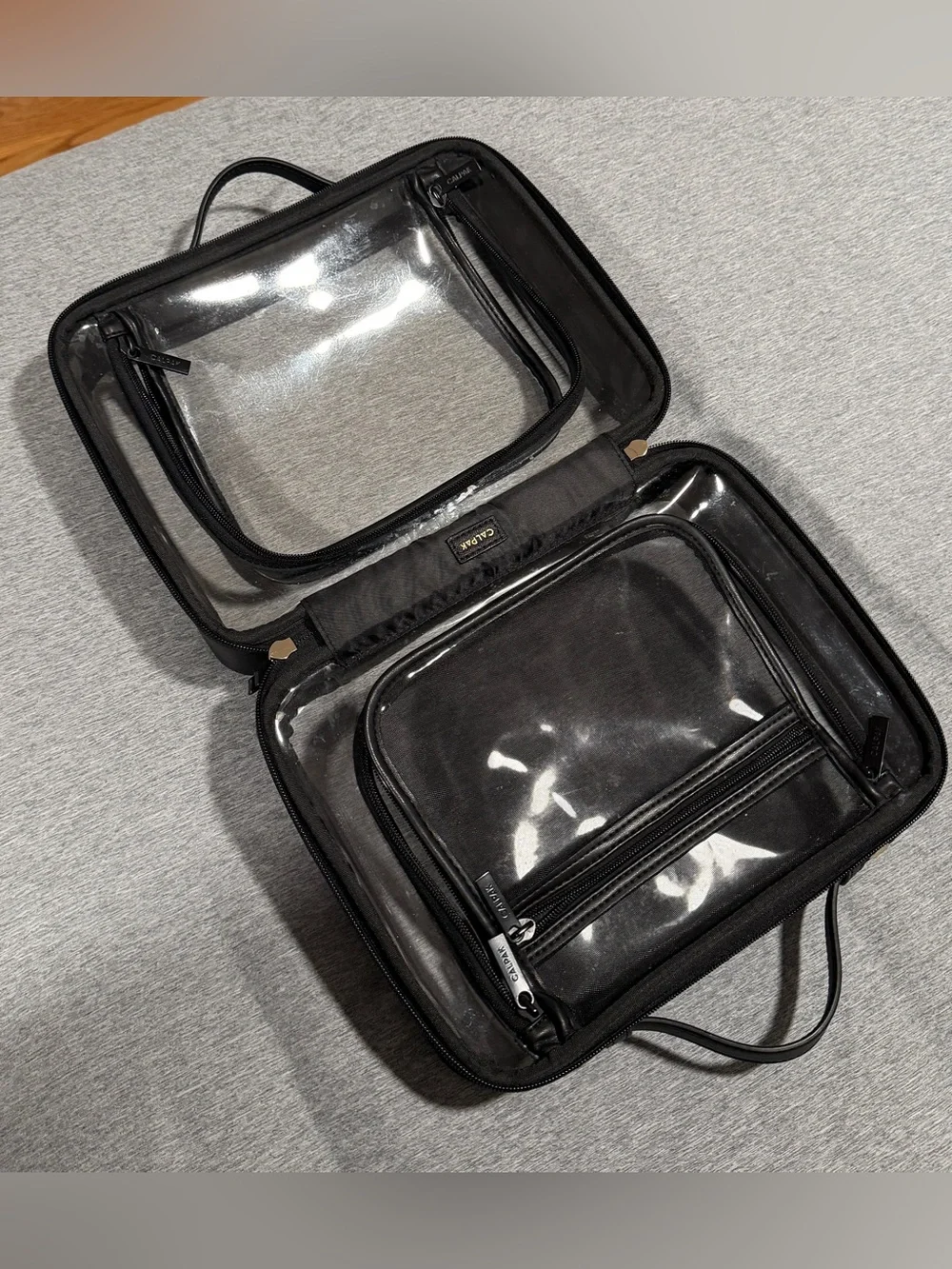 Calpak clear cosmetics/toiletry case